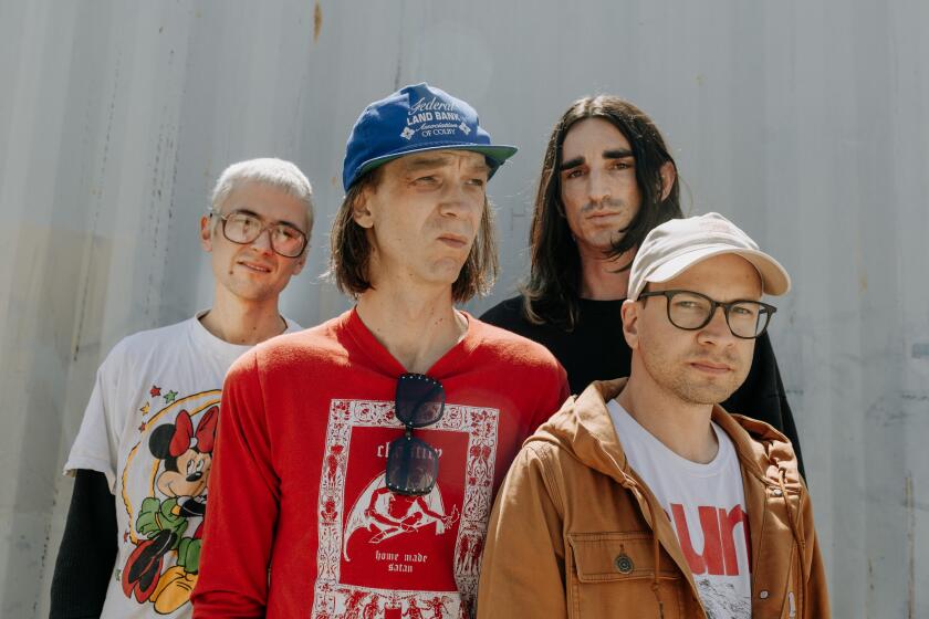 Burbank, CA - June 04: From left - Zacahary Cole Smith, Andrew Bailey, Colin Caulfield, Ben Newman of DIIV pose for a portrait at their rehearsal space in Burbank on Tuesday, June 4, 2024 in Burbank, CA. (Jason Armond / Los Angeles Times)