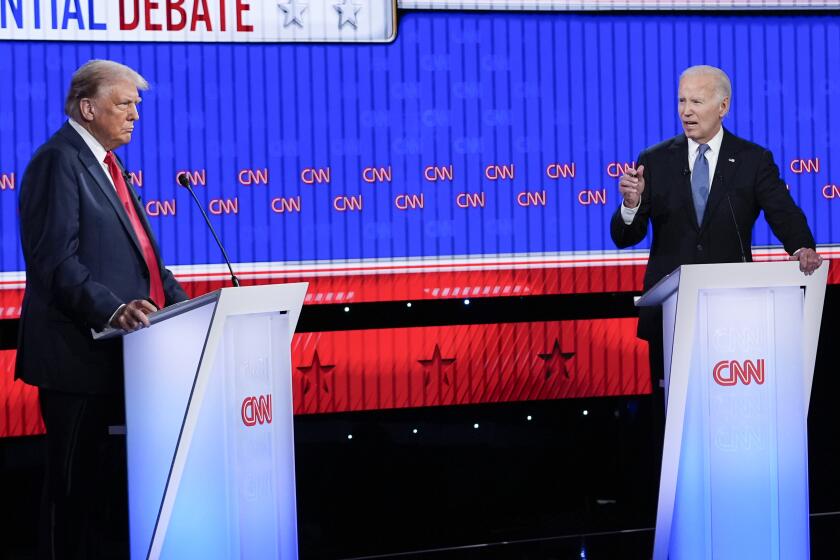 President Joe Biden, right, speaking during a presidential debate with Republican presidential candidate former President Donald Trump, left, Thursday, June 27, 2024, in Atlanta. (AP Photo/Gerald Herbert)