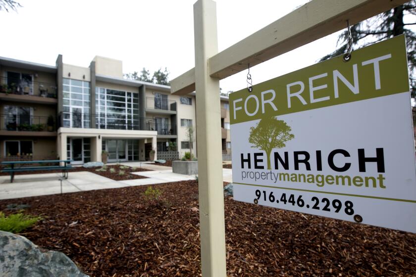 FILE - This Monday, Jan. 8, 2017, file photo shows a "For Rent" sign outside an apartment building in Sacramento, Calif. California Gov. Gavin Newsom reached a deal with apartment owners and developers Friday, Aug. 30, 2019, on legislation that would cap how rapidly rents can rise as the state grapples with a housing crisis. (AP Photo/Rich Pedroncelli, File)