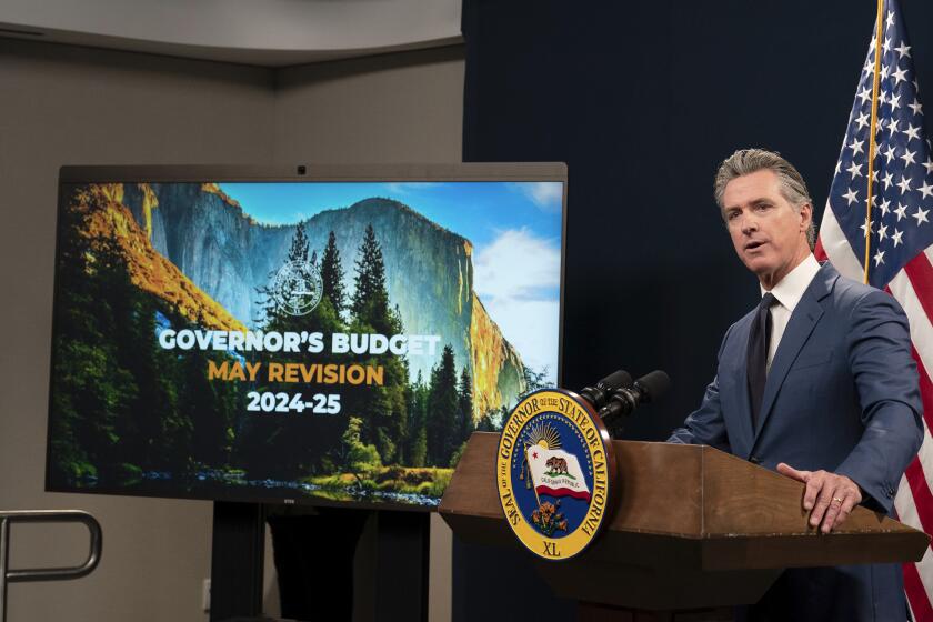 California Gov. Gavin Newsom unveils his revised 2024-25 state budget during a news conference in Sacramento, Calif., Friday, May 10, 2024. (AP Photo/Rich Pedroncelli)