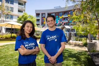 Santa Ana, CA - April 16: Mai Vo and Zach Elefante of Magic United, a bargaining unit of 1,700 workers in the characters and parades departments at Disneyland Resort who have moved to unionize under the Actors' Equity Assn. Mai works in the characters department, and Zach works in the parades department. Photo taken in Santa Ana Tuesday, April 16, 2024. (Allen J. Schaben / Los Angeles Times)