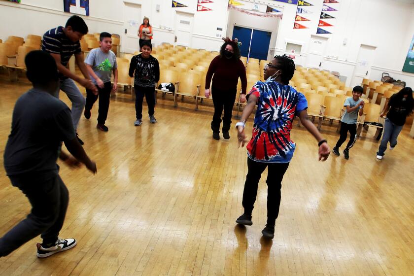 LOS ANGELES, CALIF. - DEC. 20, 2022. Students participate in a dance class offered through the Acceleration Days program at Alta Loma Elementary School in Los Angeles. After a slow start in registrations, about 72,000 Los Angeles students had signed up to be back in the classroom on their first day of winter break. (Luis Sinco / Los Angeles Times)