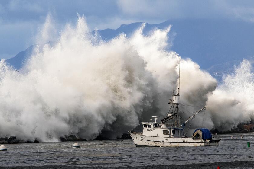 REDONDO BEACH, CA-DECEMBER 30, 2023:A large wave crashes over the rocks as viewed from the Redondo Beach Pier. A high surf warning and a coastal flood warning was issued by the National Weather Service for all Los Angeles County beaches. (Mel Melcon / Los Angeles Times)