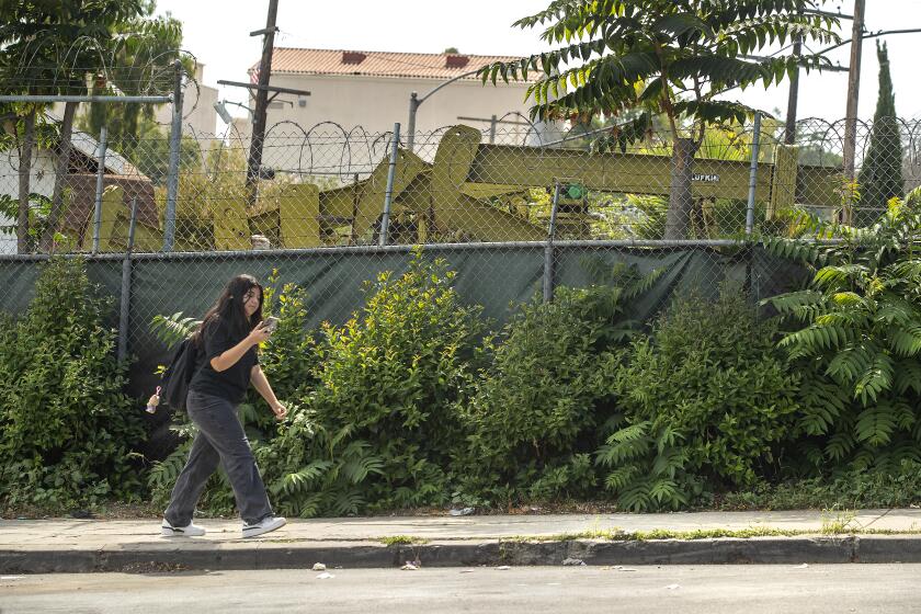 LOS ANGELES, CA-SEPTEMBER 27, 2023:An active drilling oil field on Rockwood St. is located near Alliance Ted K. Tajima High School in Los Angeles. Assembly member Wendy Carillo is urging Gov. Gavin Newsom to sign a bill the would require oil and gas companies to put more money aside to ensure wells are plugged near the end of their productive life. The bill, AB1167, already passed the senate and assembly, but there is concern that Newsom will veto it because his Department of Finance has opposed the bill, arguing the measure's added financial obligations could create more orphaned oil wells. (Mel Melcon / Los Angeles Times)