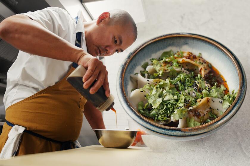 OTOTO chef Charles Namba squeezing sauce in a bowl