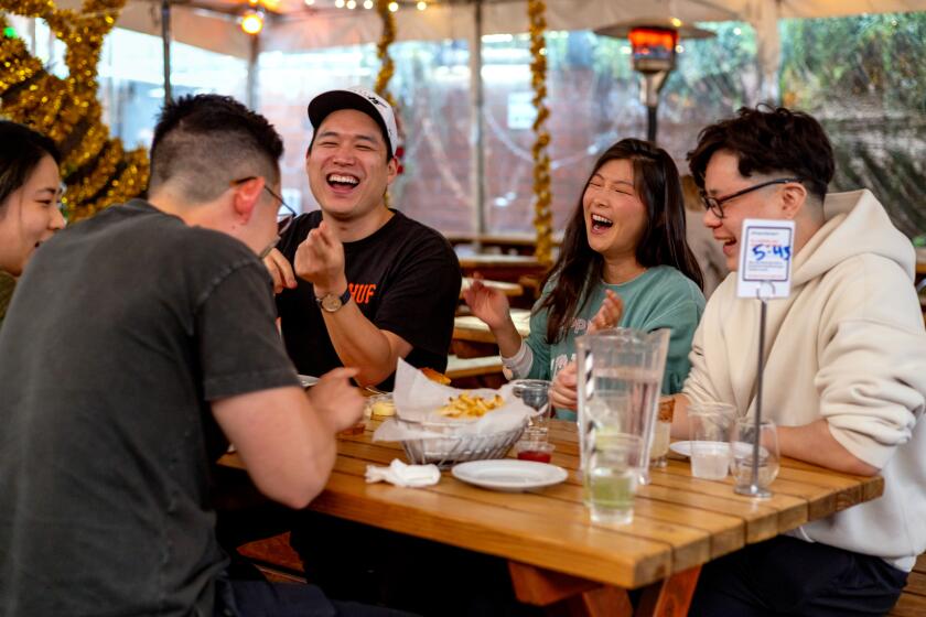 LOS ANGELES, CA - JANUARY 13, 2024: Diners enjoy the company and drinks at the Everson Royce Bar in the Arts District establishment in downtown Los Angeles on Saturday, Jan. 13, 2024. (Silvia Razgova / For The Times)